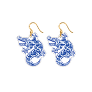 Pair of blue alligator clear acrylic dangle earrings with connected gold hooks