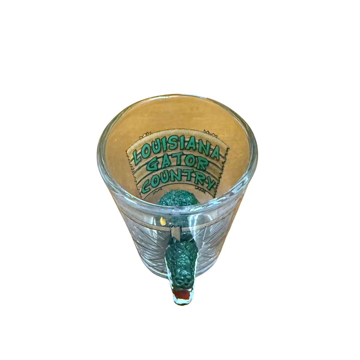 Glass shot glass with 'Louisiana Gator Country' text on background