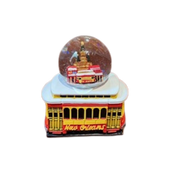 Decorative item with a New Orleans theme featuring a streetcar and a ball on top.