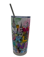 Tumbler with colorful New Orleans-themed design and straw on a white background