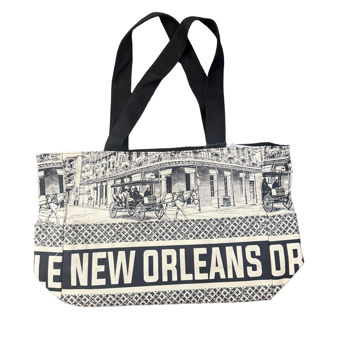 Black-and-white New Orleans tote bag with French Quarter architecture, ornate balconies, horse-drawn carriages, and black handles
