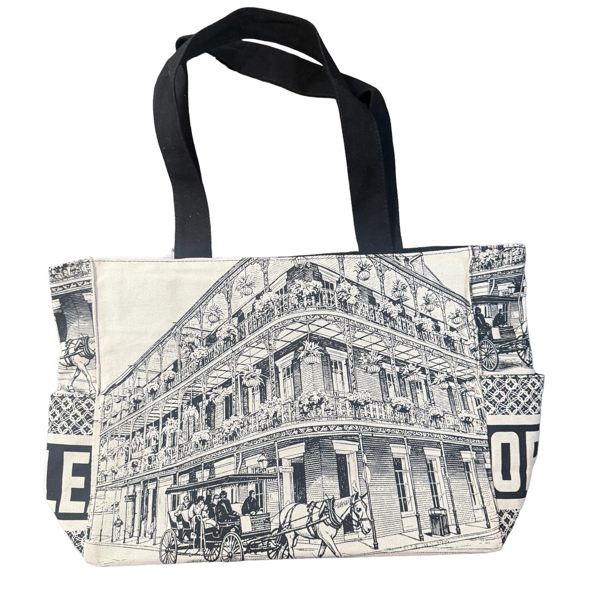 Black-and-white New Orleans tote bag featuring French Quarter balconies, historic architecture, and horse-drawn carriage artwork.