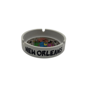 Gray ashtray with 'New Orleans' text and colorful design on a white background
