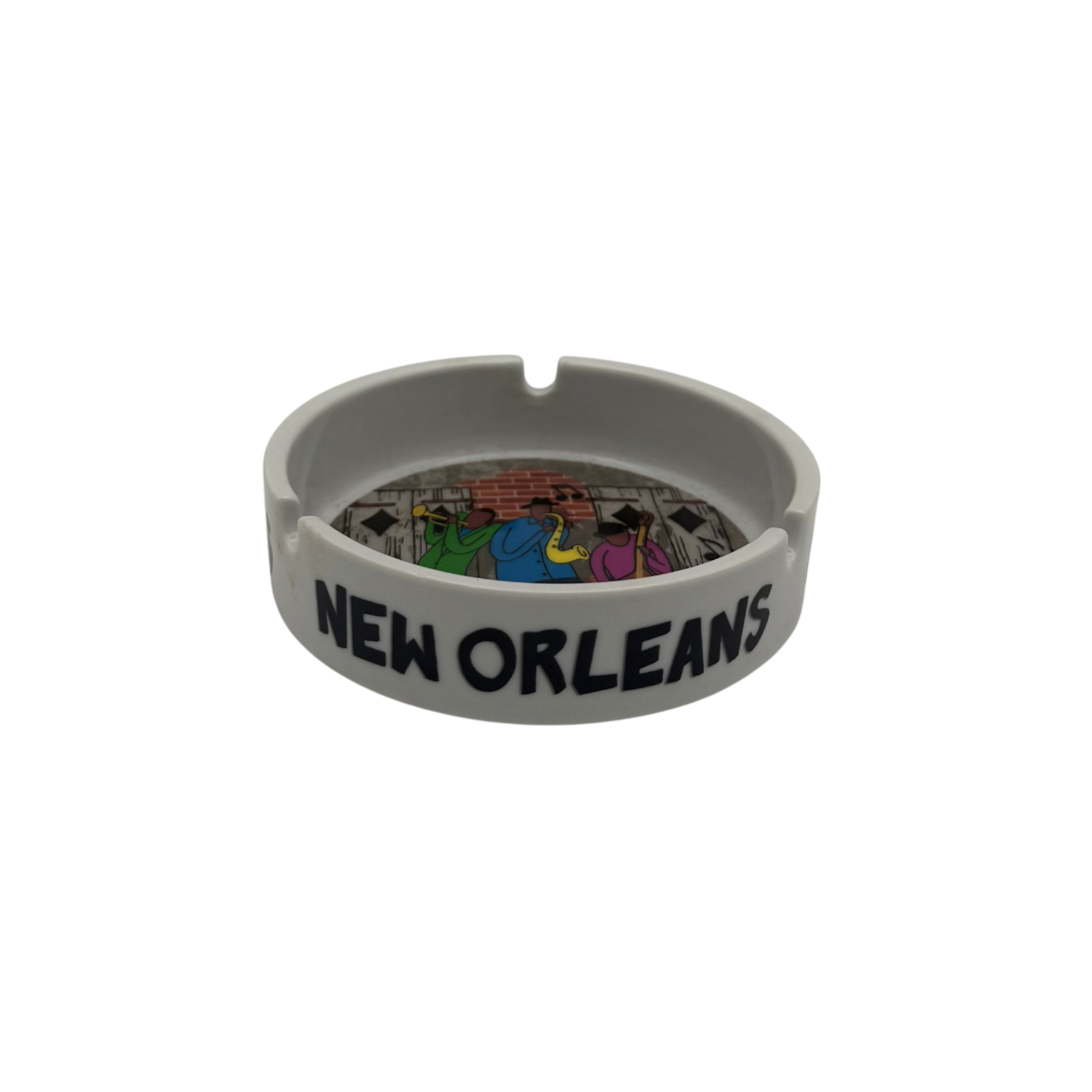 Gray ashtray with 'New Orleans' text and colorful design on a white background