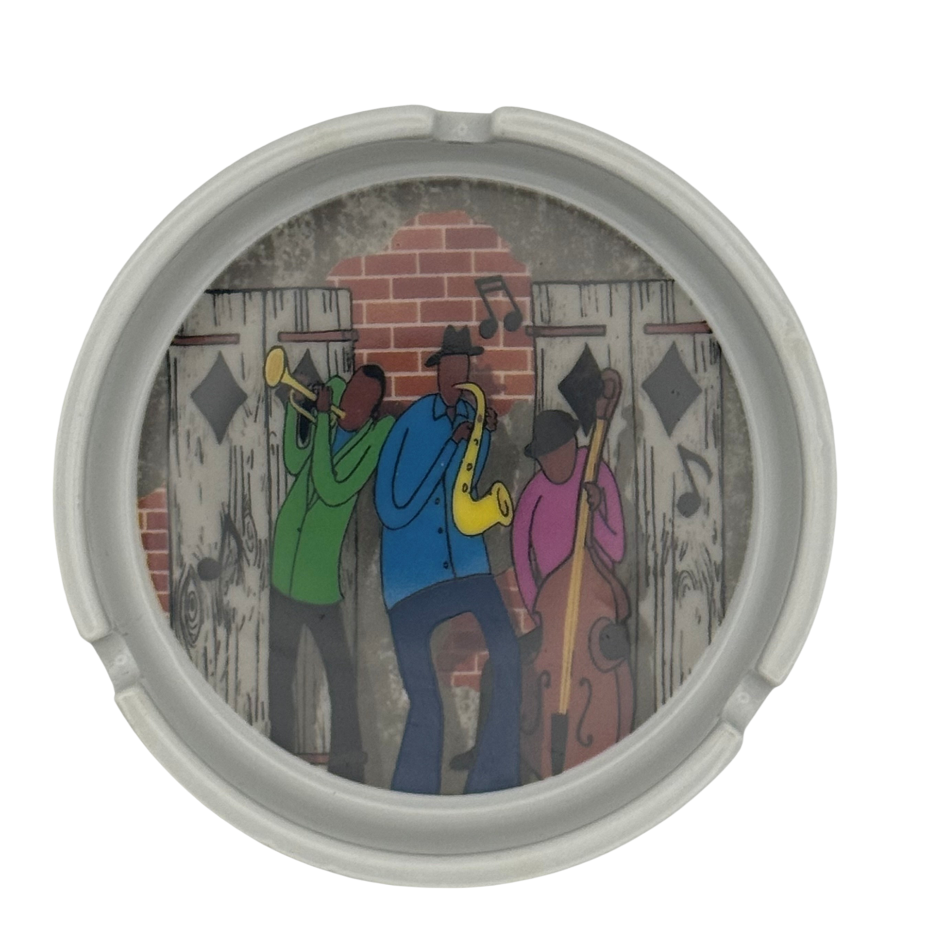 Round container with a colorful illustration of three musicians playing instruments on a brick wall background.