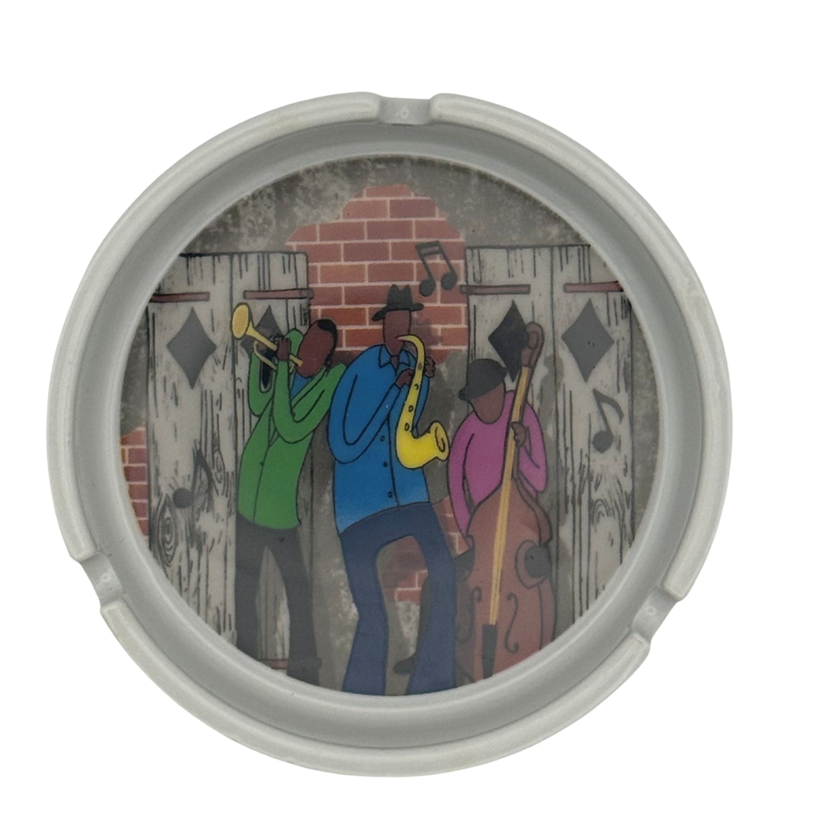 Round container with a colorful illustration of three musicians playing instruments on a brick wall background.