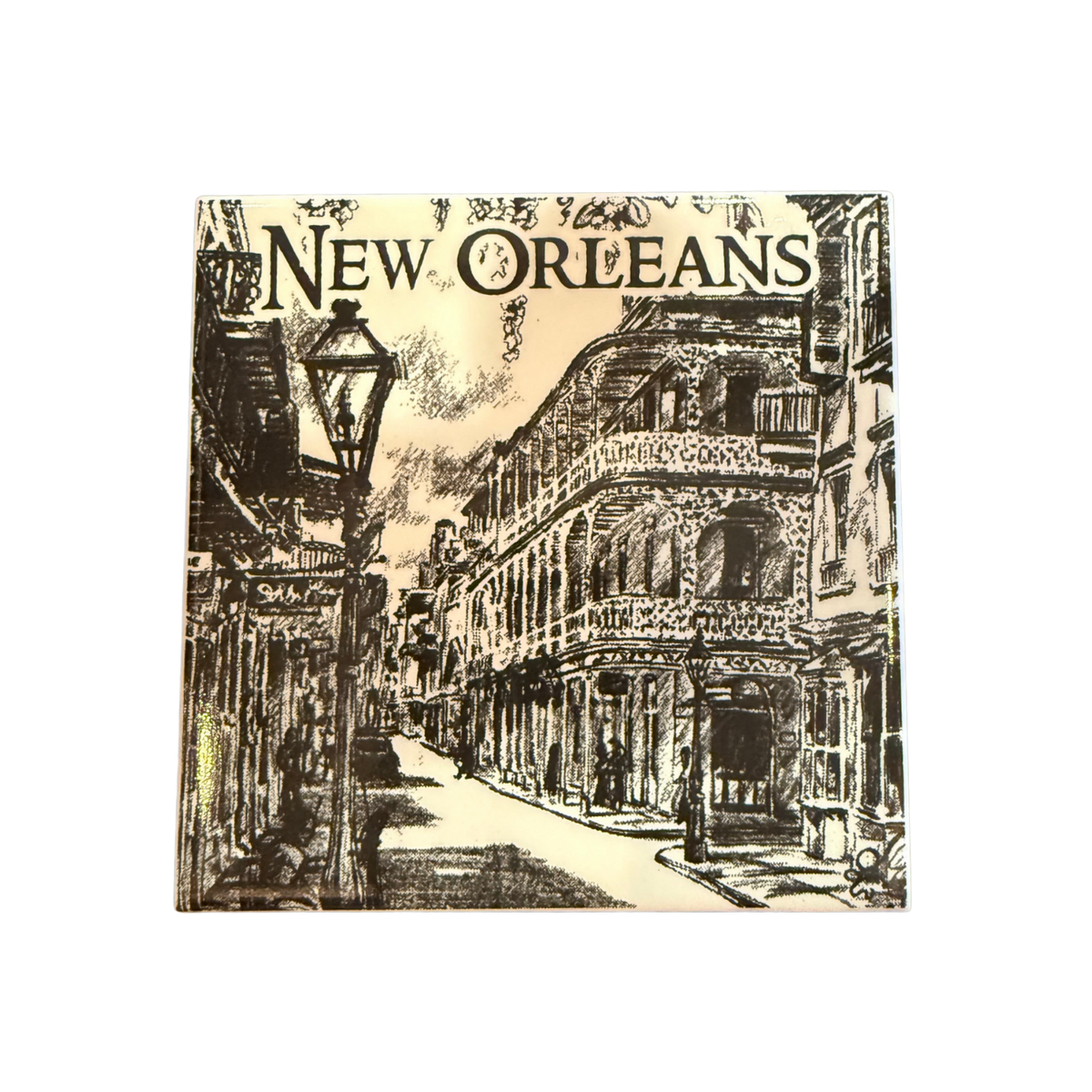 A square art ceramic tile featuring a black ink sketch of a New Orleans street scene with ornate balconied buildings, a vintage street lamp, and the word 'New Orleans' across the top.