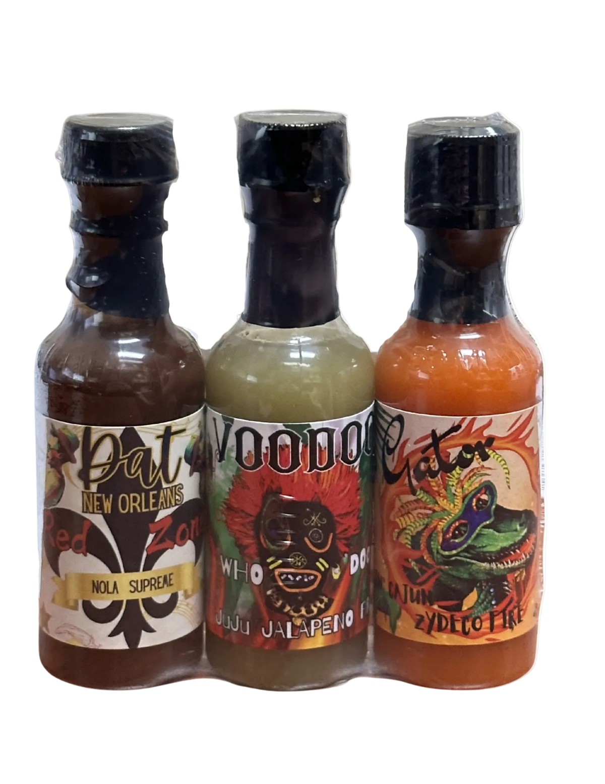 Three hot sauce bottles with colorful labels on a white background
