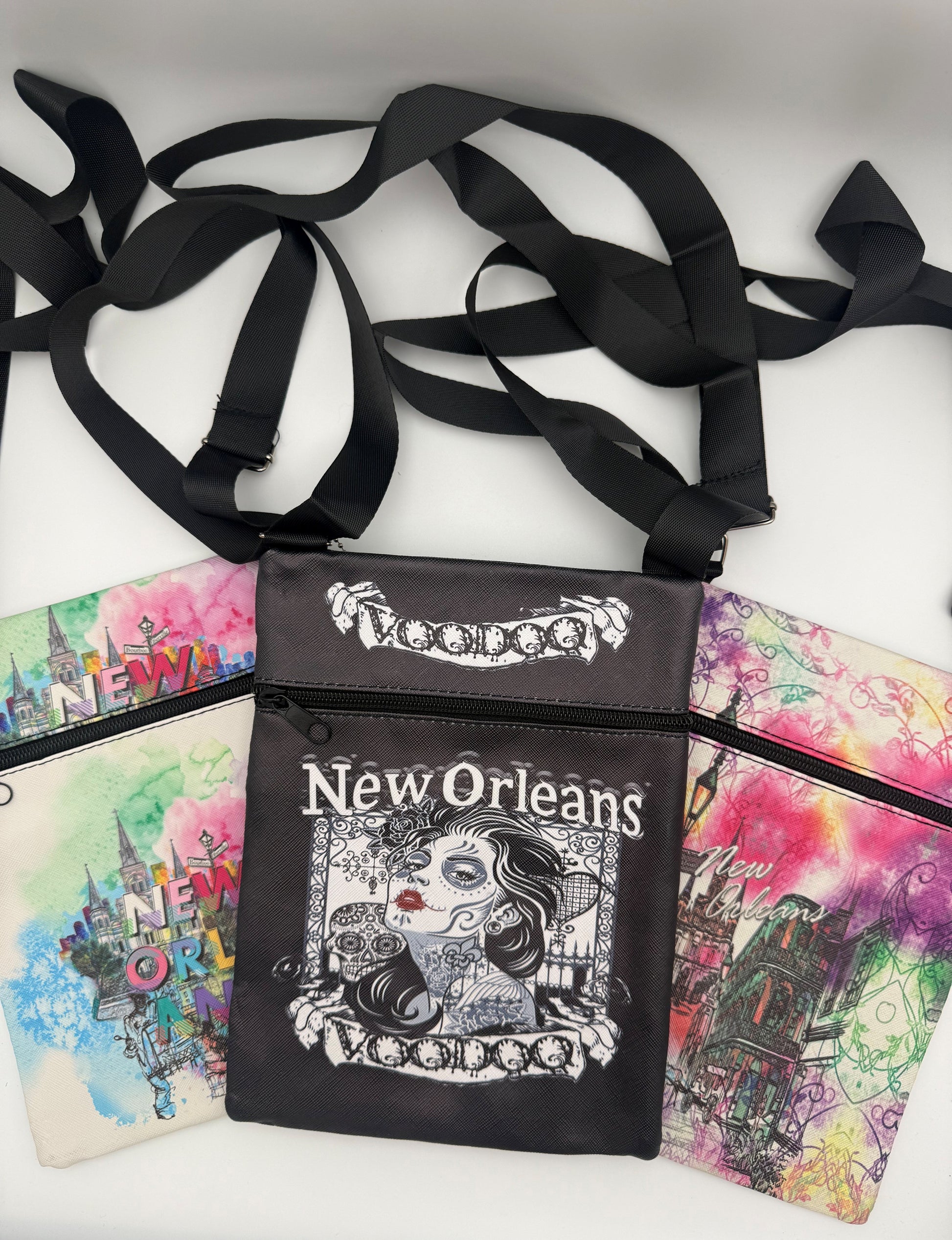 Black bag with 'New Orleans Voodoo' text and design, surrounded by colorful New Orleans-themed cards.