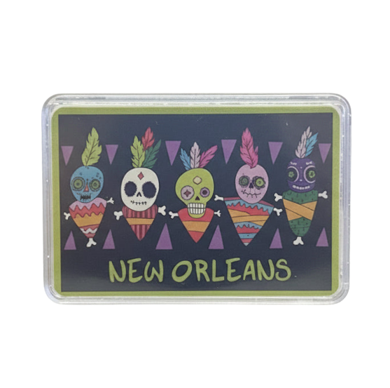 A rectangular printed card or coaster with rounded corners, shown in a clear plastic sleeve on a white background. The design features five colorful sugar skull figures above the words “NEW ORLEANS” in yellow-green lettering on a dark charcoal background.