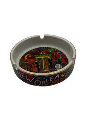 Colorful New Orleans-themed ashtray on a white background